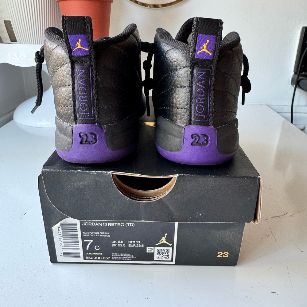 Jordan 12 Retro Black and Purple High-Top Sneakers with Jumpman Logo